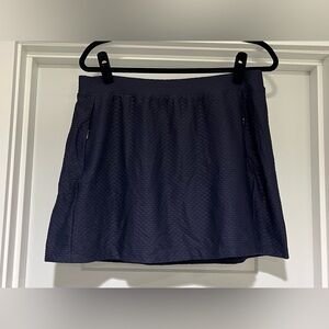Tail Navy Golf Skort. Size Large. Waist 16.5” flat, length 16”.